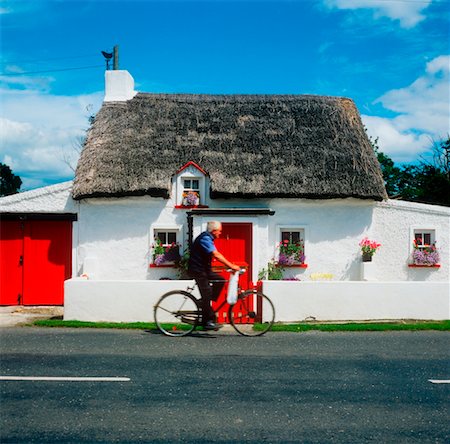 simsearch:832-03639876,k - Side profile of a man riding a bicycle in front of a cottage, Mooncoin, County Kilkenny, Republic Of Ireland Stock Photo - Rights-Managed, Code: 832-02252628