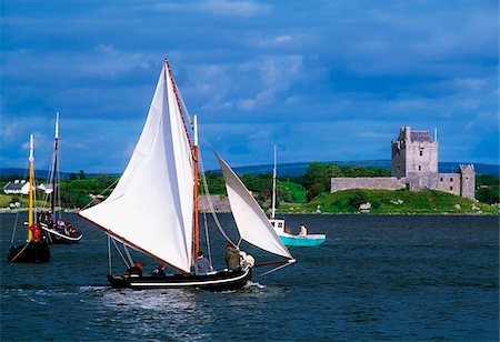 Dunguaire Castle, Co Galway, Ireland; Traditional Galway hookers racing during Kinvara Regatta Stock Photo - Rights-Managed, Code: 832-03359026