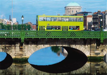Dublin, Co Dublin, Ireland; Dublin Bus Going Over The Capel St. Bridge With Four Courts In The Background Stock Photo - Rights-Managed, Code: 832-03639669