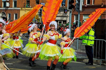 Dublin, Ireland; Women In Costume Dance With Large Feathers As Part Of A Parade On O'connell Street Stock Photo - Rights-Managed, Code: 832-03640988