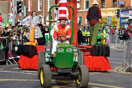 float (parade) - Dublin, Ireland; A Man In Costume Driving A Green Tractor Pulling A Float In A Parade On O'connell Street Stock Photo - Rights-Managed, Code: 832-03641008