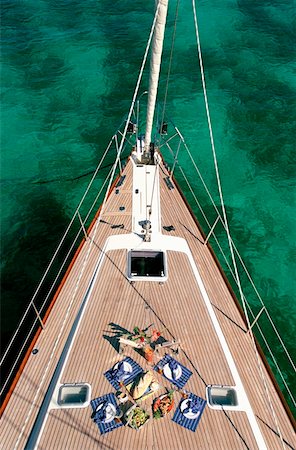 sailboats water nobody - Food set on the deck on a yacht sailing around the Grenadines Stock Photo - Rights-Managed, Code: 832-03724073