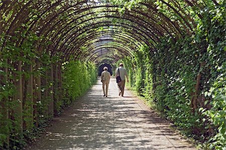 Couple walking in Mirabell Gardens Stock Photo - Rights-Managed, Code: 832-03724148