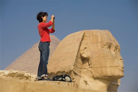 egypt - Woman taking photograph in front of Sphinx and pyramid Stock Photo - Rights-Managed, Code: 832-03724619