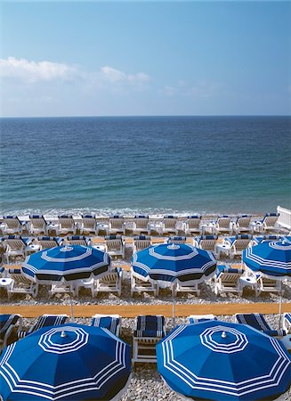 deserted beach - Umbrellas and sun beds on the beach Stock Photo - Rights-Managed, Code: 832-03724655
