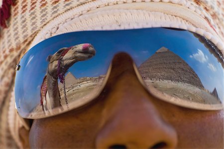 pyramids of giza close up - Camel and pyramids reflecting in local man's sunglasses Stock Photo - Rights-Managed, Code: 832-03724650