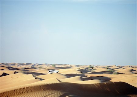 dune driving - Jeep driving across dunes at dusk near Dubai Stock Photo - Rights-Managed, Code: 832-03724908
