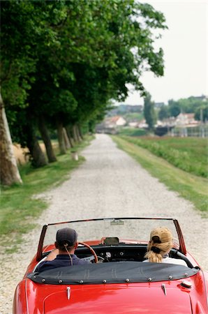 Couple driving in open top Austin Healey Car Stock Photo - Rights-Managed, Code: 832-03725033