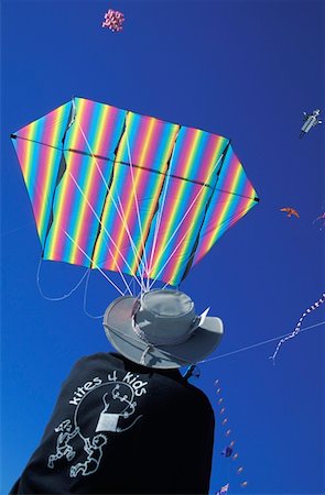 flying kite not illustration not monochrome - Man flying kite in Kite Festival Stock Photo - Rights-Managed, Code: 832-03723607