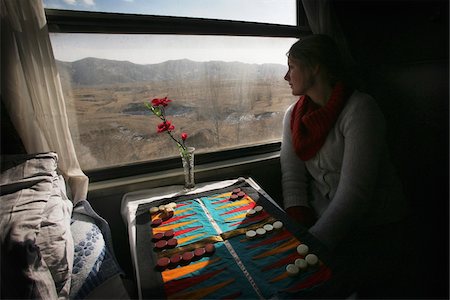 passenger (female) - Female backpacker looking out of sleeper train window. Stock Photo - Rights-Managed, Code: 832-03723782