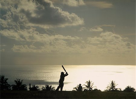 Man playing cricket by coastline in silhouette Stock Photo - Rights-Managed, Code: 832-03723948