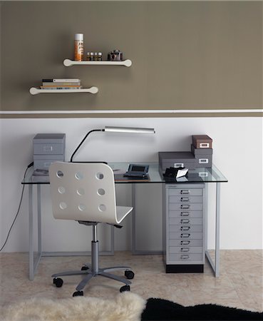 Home Office with metal framed glass desk, perforated chair and cantilevered shelves. Designed by Designed by www.marythum.com Stock Photo - Rights-Managed, Code: 845-04827153