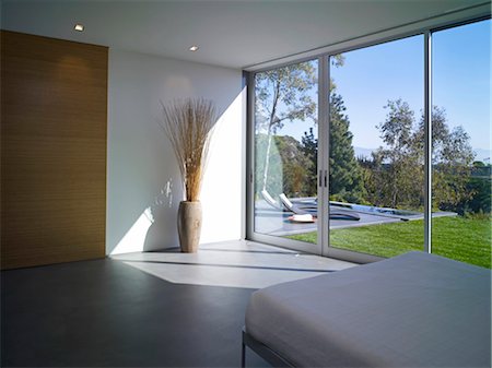 simsearch:845-06008034,k - View through glass doors of sparsely furnished bedroom in Briarcrest House, Beverly Hills, California, USA. Architects: SPF Architects Stock Photo - Rights-Managed, Code: 845-05837902