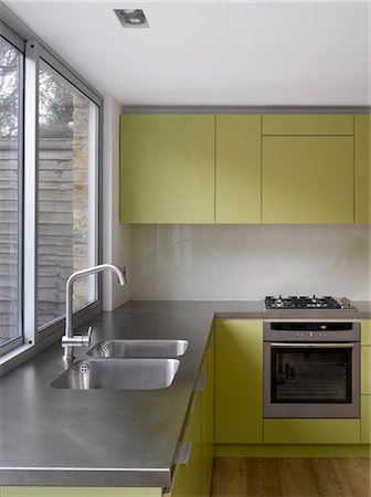 simsearch:845-07561516,k - Stainless steel sink at uncurtained window of kitchen extension in Islington, London, UK. Paul Archer Design. Architects: Paul Archer Design Stock Photo - Rights-Managed, Code: 845-05837952