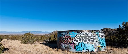 simsearch:845-05838406,k - Landscape with graffiti-covered water tank in field, Golden, New Mexico. Stock Photo - Rights-Managed, Code: 845-05838353