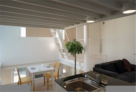 exposed beam ceiling - Stainless steel sink set in unit with table for two beyond Stock Photo - Rights-Managed, Code: 845-05838929