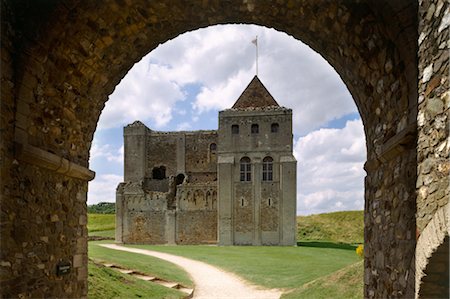 Castle Rising Castle. The east face of the keep seen through the gatehouse arch. Stock Photo - Rights-Managed, Code: 845-05839383