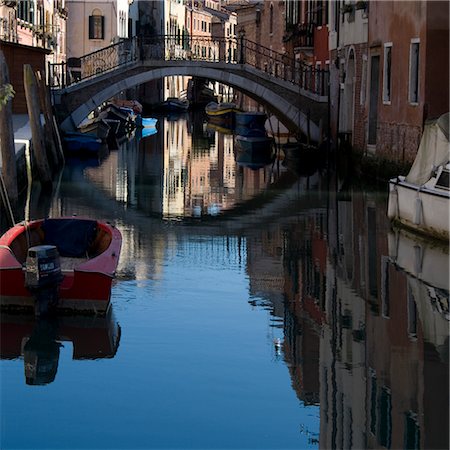 Moored boats and bridge on canal in Cannaregio district, Venice. Stock Photo - Rights-Managed, Code: 845-06007943