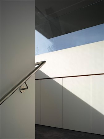 staircase architecture - Stainless steel hand rail in staircase of Pond and Park House, Dulwich, London, UK. Architects: Stephen Marshall Stock Photo - Rights-Managed, Code: 845-06008054