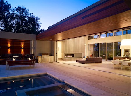 detached house - Dusk light over pool terrace open to the living room of Menlo Park Residence, USA. Stock Photo - Rights-Managed, Code: 845-07561392