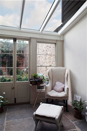 Armchair in corner of conservatory extension, Whitechapel, London Stock Photo - Rights-Managed, Code: 845-07561434