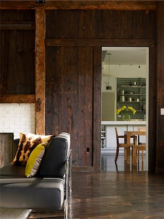 photos old barns - Sitting room in converted barn with view to kitchen, USA Stock Photo - Rights-Managed, Code: 845-07561480