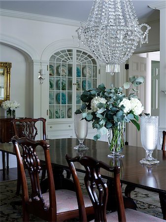 simsearch:845-06008034,k - Glass chandelier above dark wood dining table in Shelley Morris Designed Colonial style residence in New Canaan, Connecticut, USA Stock Photo - Rights-Managed, Code: 845-07561504