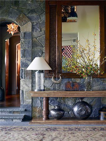 Wooden mirror above table in hallway of USA home Stock Photo - Rights-Managed, Code: 845-07561507