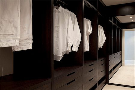 simsearch:845-05838374,k - Clothes hanging in an open wardrobe. Stock Photo - Rights-Managed, Code: 845-08939652