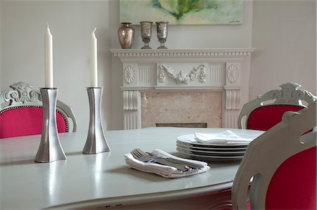 White dining table with two candles and pink upholstered chairs Stock Photo - Rights-Managed, Code: 845-08939798