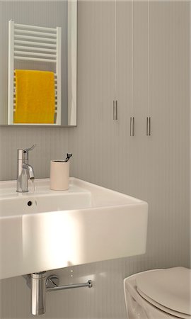 simsearch:845-07561516,k - Modern white bathroom, detail of washbasin with rflection of wall radiator towel rail. Architects: Tonkin Liu Architects Stock Photo - Rights-Managed, Code: 845-03720444
