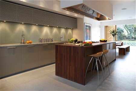 Pond and Park House, Dulwich, London. Modern open-plan kitchen with dark wood island unit. Architects: Stephen Marshall Stock Photo - Rights-Managed, Code: 845-03720709