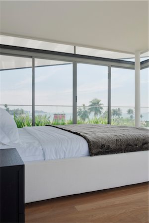 simsearch:845-06008034,k - Modern bedroom with views from picture windows. Architects: Lim Cheng Kooi and AR43 Stock Photo - Rights-Managed, Code: 845-03720869
