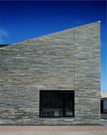 eco house - Scotland's Housing Expo. The Stone House. looking at the front wall of the double height end of the terrace. Architects: NORD Stock Photo - Rights-Managed, Code: 845-03721263