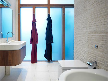 simsearch:845-07561516,k - Two bath robes hanging in a modern bathroom. Architects: STUDIO BEDNARSKI LTD Stock Photo - Rights-Managed, Code: 845-03777463