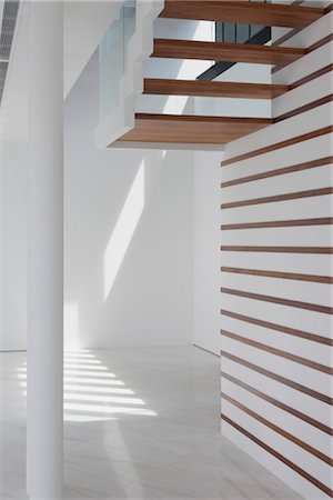 steps inside house - Modern white living space, view from under steps. Architects: Lim Cheng Kooi and AR43 Stock Photo - Rights-Managed, Code: 845-03777555