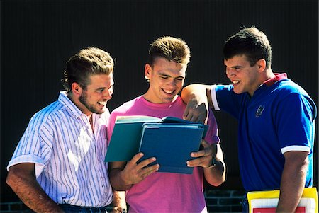 1990s THREE COLLEGE AGE MEN SMILING LOOKING AT BOOK Stock Photo - Rights-Managed, Code: 846-05645768