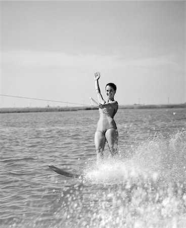 simsearch:846-02797740,k - 1960s WOMAN WATER SKIING WAVING WITH ONE HAND Stock Photo - Rights-Managed, Code: 846-05645892