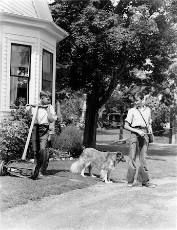 retro fishing - 1940s BOY WITH FISHING GEAR COLLIE DOG SECOND BOY MOWING GRASS WITH PUSH MOWER Stock Photo - Rights-Managed, Code: 846-05645906