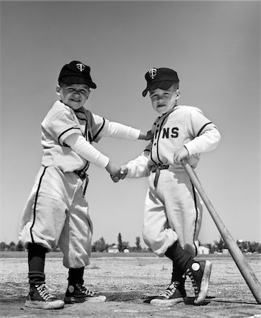 simsearch:846-05647924,k - 1960s PAIR OF LITTLE LEAGUERS IN UNIFORM SHAKING HANDS ONE HOLDING BAT LOOKING AT CAMERA Stock Photo - Rights-Managed, Code: 846-05645967