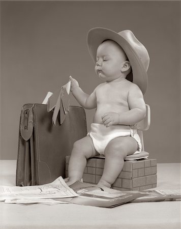 1950s BABY BUSINESSMAN IN DIAPER WITH HAT BRIEFCASE SALESMAN SAMPLES PAPERWORK Stock Photo - Rights-Managed, Code: 846-05646083