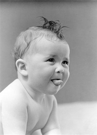 sticking out her tongue - 1940s CUTE BABY STICKING OUT TONGUE STUDIO Stock Photo - Rights-Managed, Code: 846-05646122