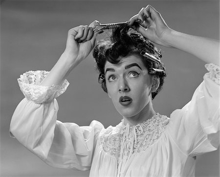 simsearch:600-03018098,k - 1950s WOMAN IN NIGHTGOWN PUTTING ROLLER CLIPS IN HAIR Stock Photo - Rights-Managed, Code: 846-05646216