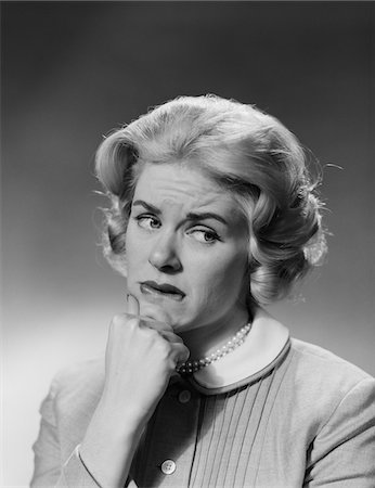 simsearch:846-08030391,k - 1950s BLONDE WOMAN FIST TO CHIN WORRIED SERIOUS FACIAL EXPRESSION Stock Photo - Rights-Managed, Code: 846-05646392