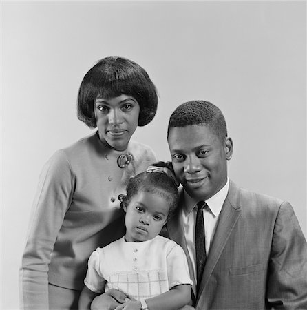 1960s AFRICAN-AMERICAN FAMILY PORTRAIT FATHER MOTHER DAUGHTER LOOKING AT CAMERA Stock Photo - Rights-Managed, Code: 846-05646496