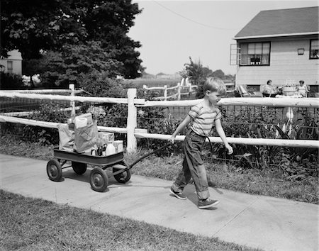 suburbia 1950s america - 1950s BOY PULLING GROCERIES IN WAGON Stock Photo - Rights-Managed, Code: 846-05646493