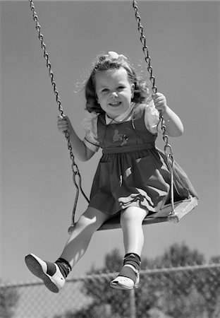 playground retro - 1940s SMILING GIRL SWINGING ON PLAYGROUND SWING Stock Photo - Rights-Managed, Code: 846-05646577