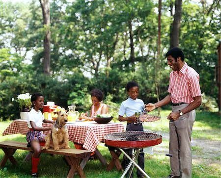 picnicking - 1970s AFRICAN AMERICAN FAMILY BACKYARD PICNIC BARBECUE Stock Photo - Rights-Managed, Code: 846-05646775