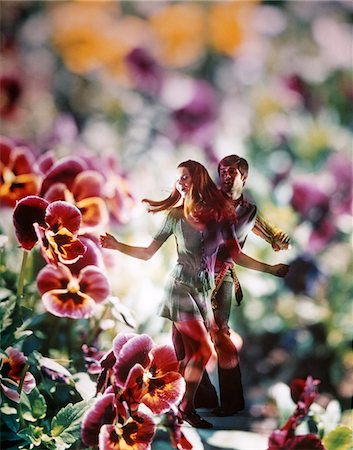 1960s - 1970s YOUNG COUPLE DANCING AMONG PANSY FLOWERS SUPERIMPOSED GRAPHIC EFFECT Stock Photo - Rights-Managed, Code: 846-05646796