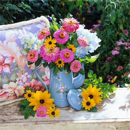 pink floral vintage - BOUQUET OF BLACK EYED SUSANS AND PINK FLOWERS IN PITCHER ON GARDEN BENCH Stock Photo - Rights-Managed, Code: 846-05646909